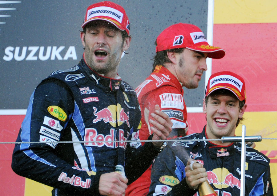 The top three celebrate on the podium