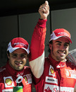 Fernando Alonso celebrates pole with Felipe Massa