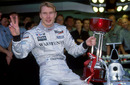 Mika Hakkinen celebrates winning the first of his two world titles