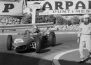 During practice, the Lotus of Stirling Moss stopped at the Station corner. While Moss waited for assistance, Wolfgang von Trips came by in the new Ferrari 156