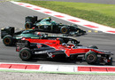 Timo Glock, Jarno Trulli and Heikki Kovalainen come out of the first chicane side-by-side