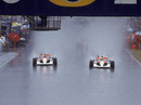 Gerhard Berger and Ayrton Senna lead the field away in atrocious conditions in Adelaide