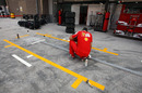 A Ferrari team member sorts out equipment in the pits