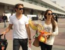 Jenson Button arrives at the circuit with girlfriend Jessica Michibata