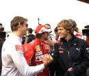 Jenson Button greets Sebastian Vettel on Thursday