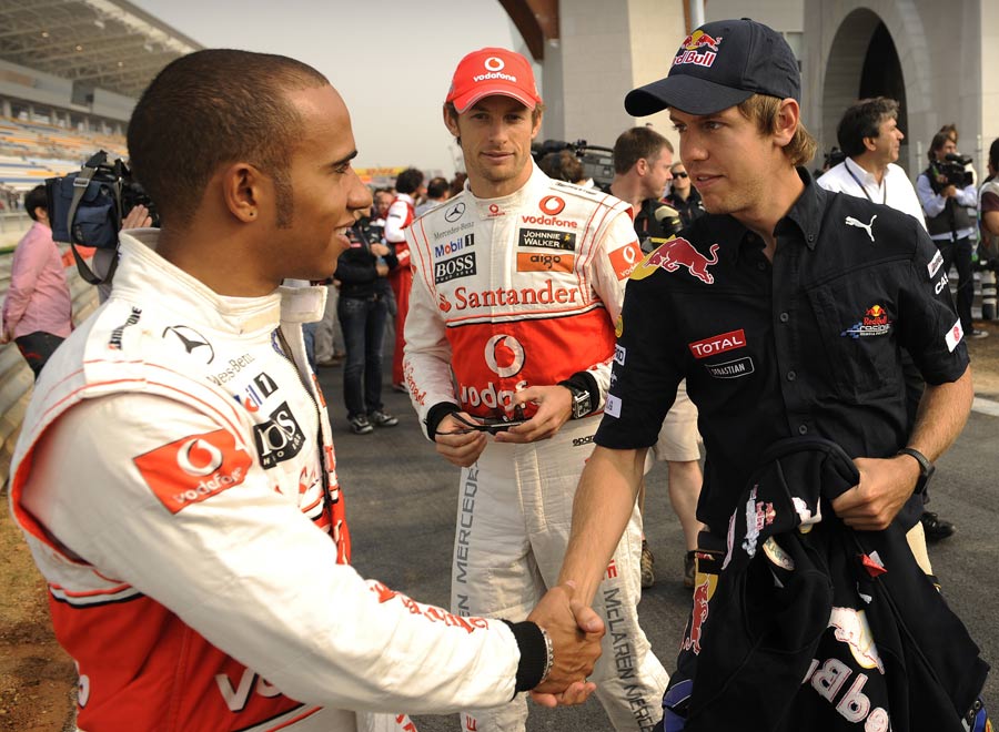 Lewis Hamilton greets title rival Sebastian Vettel