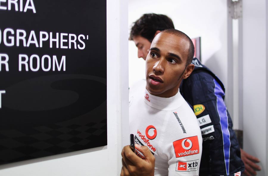 Lewis Hamilton makes his way to the press conference