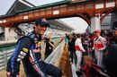 Mark Webber gets ready to pose for photos on the barrier