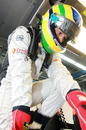 Bruno Senna gets into his HRT's cockpit