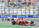 Fernando Alonso leads Tonio Liuzzi during practice