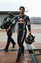 Mark Webber walks back to the pits