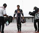 Mark Webber walks back after crashing out of the Korean Grand Prix