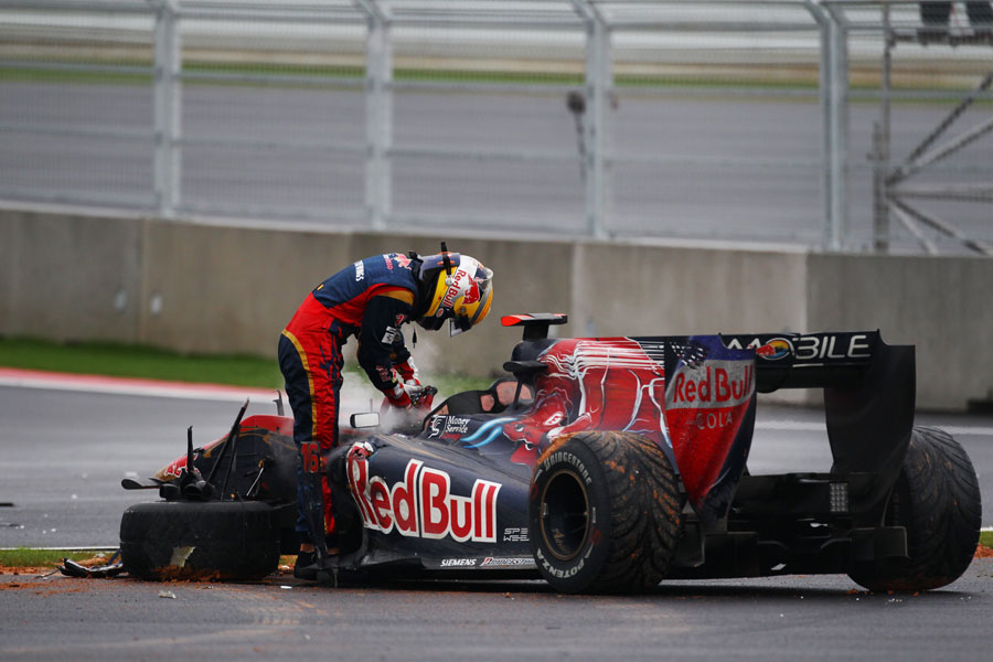 Sebastien Buemi climbs out of his wrecked Toro Rosso