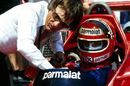 Bernie Ecclestone talks to Niki Lauda at the Brazilian Grand Prix