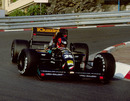 Perry McCarthy negotiates the Loews Hairpin in his Andrea Moda