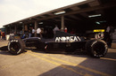 An Andrea Moda in the pit lane