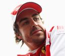 Fernando Alonso looks on during the drivers' parade
