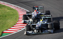 Nico Rosberg and Michael Schumacher battle for position at Suzuka