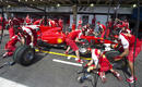 Ferrari mechanics practice a pit stop