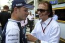 Rubens Barrichello talks to fellow Brazilian racing legend, Emerson Fittipaldi