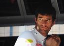 Mark Webber monitors proceedings from the pit wall