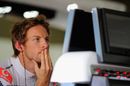Jenson Button monitors the situation