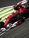 Felipe Massa clips the apex in his Ferrari