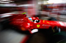 Fernando Alonso leaves the garage on full wet tyres