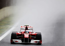 Fernando Alonso enters turn one in his Ferrari