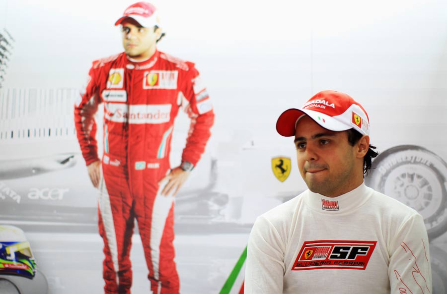 Felipe Massa sits in the shadow of his portrait