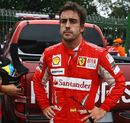 Fernando Alonso waits to be interviewed