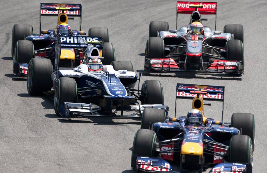 Sebastian Vettel leads Nico Hulkenberg, Mark Webber and Lewis Hamilton
