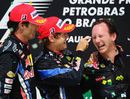 Mark Webber and Sebastian Vettel celebrate with Red Bull boss Christian Horner on the podium
