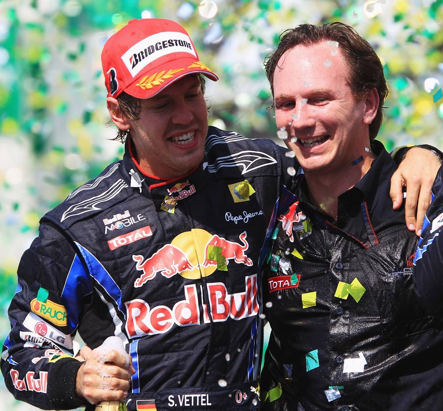 Sebastian Vettel celebrates with Red Bull boss Christian Horner 