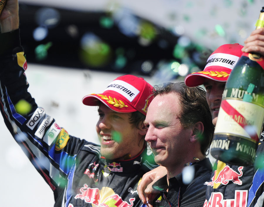 Sebastian Vettel, Christian Horner and Mark Webber celebrate on the podium