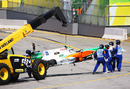 Tonio Liuzzi's wrecked Force India is craned away