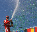Fernando Alonso celebrates his podium finish