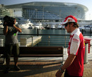 Fernando Alonso is videoed walking to the paddock