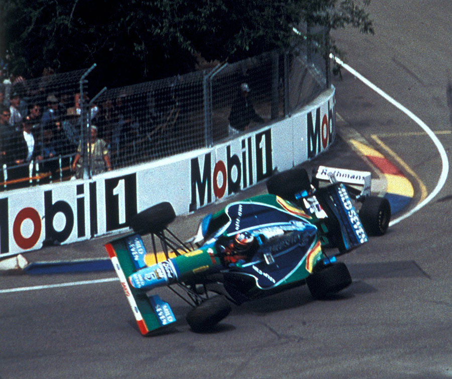 Michael Schumacher's Benetton is launched into the air after making contact with Damon Hill
