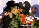 Emerson Fittipaldi celebrates his second world championship title on the podium with wife Maria-Helena