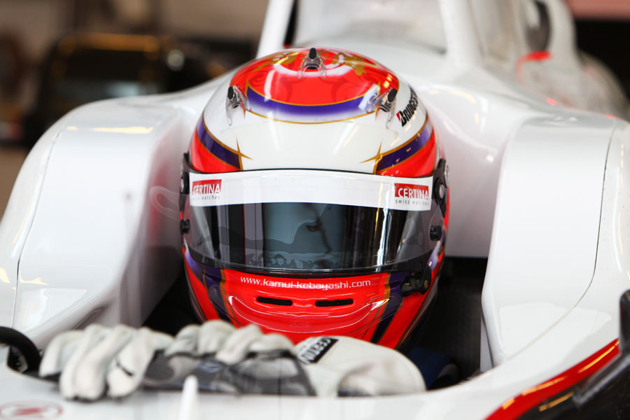 Kamui Kobayashi sits in his Sauber cockpit ahead of the morning's action