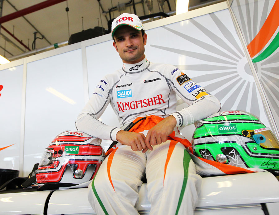 Tonio Liuzzi poses for a photograph in the Force India garage