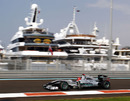 Michael Schumacher flashes past yachts in the harbour