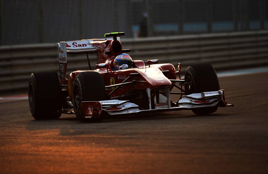Fernando Alonso drives in the setting sun
