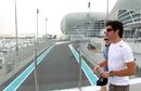 Mark Webber arrives at the Yas Marina circuit