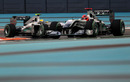 Michael Schumacher leads Nico Rosberg during qualifying