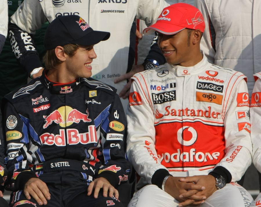 Lewis Hamilton shares a joke with Sebastian Vettel