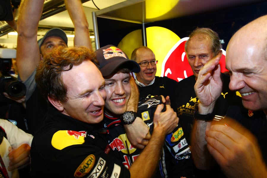 Red Bull boss Christian Horner celebrates with Sebastian Vettel 