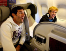 Mark Webber and Sebastian Vettel share a joke on the plane home