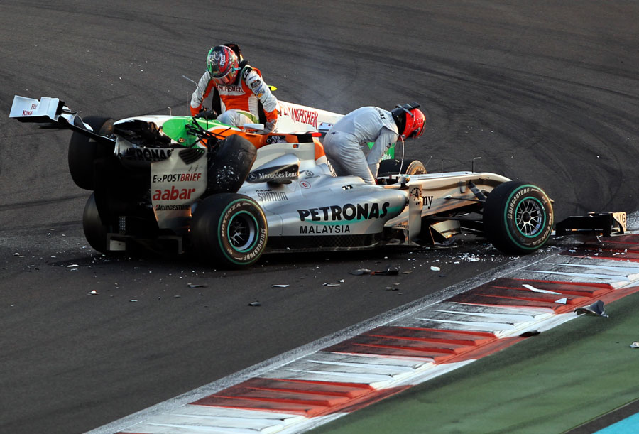 Tonio Liuzzi and Michael Schumacher get out of their cars